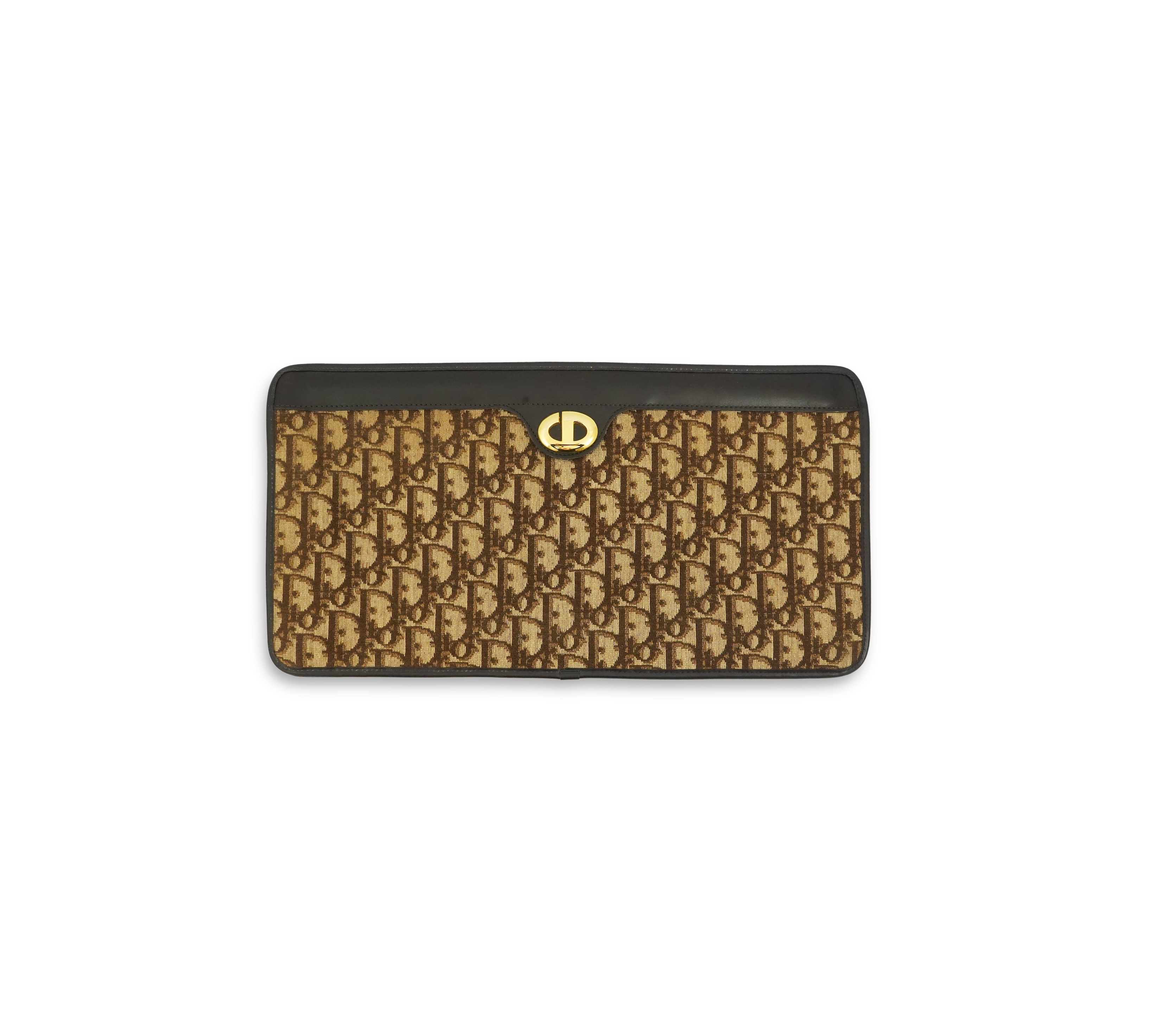 A vintage Dior brown cloth and leather trim monogram clutch bag